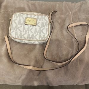 Small tan and white shoulder bag